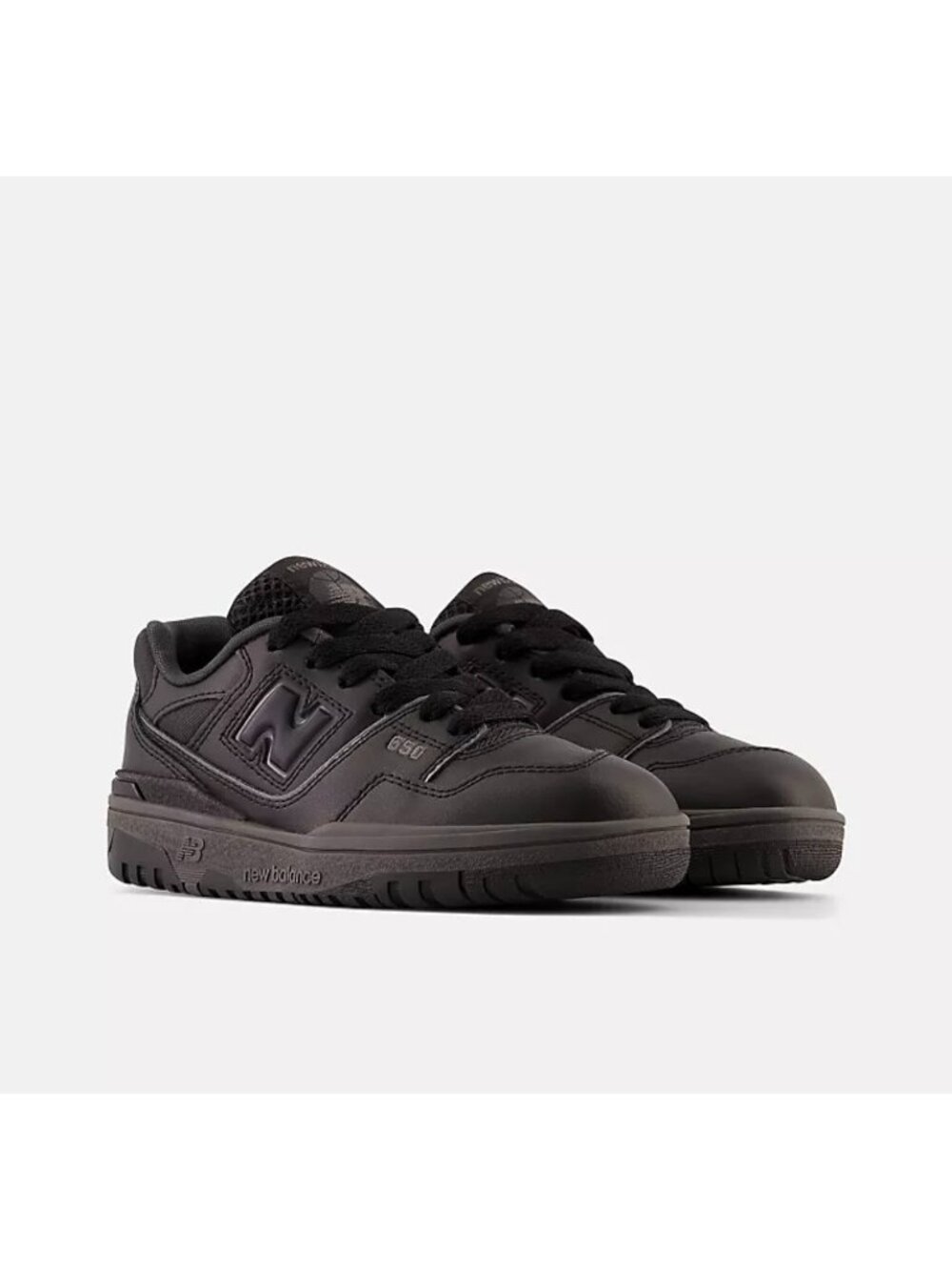 New Balance 550 Triple Black sneakers featuring an all-black boys size 6.5